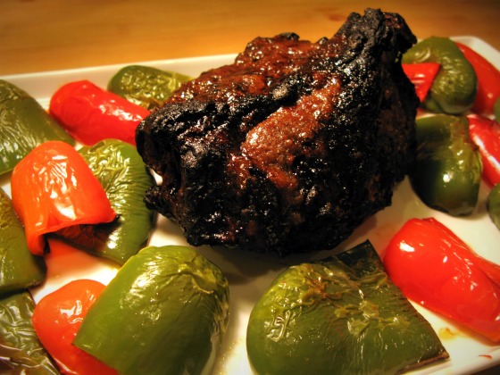 Pork shoulder roast with roasted red and green peppers